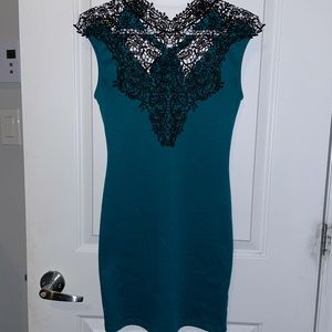 Limité turquoise dress with laced neckline